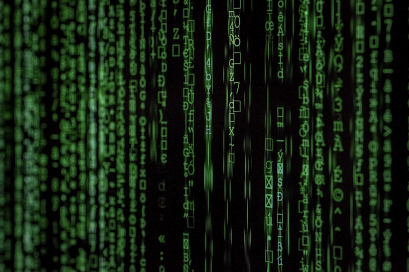 Prompt: A dark stylized hacker or cyber environment with abstract glowing code matrices, highly technical, dark mode, no humans